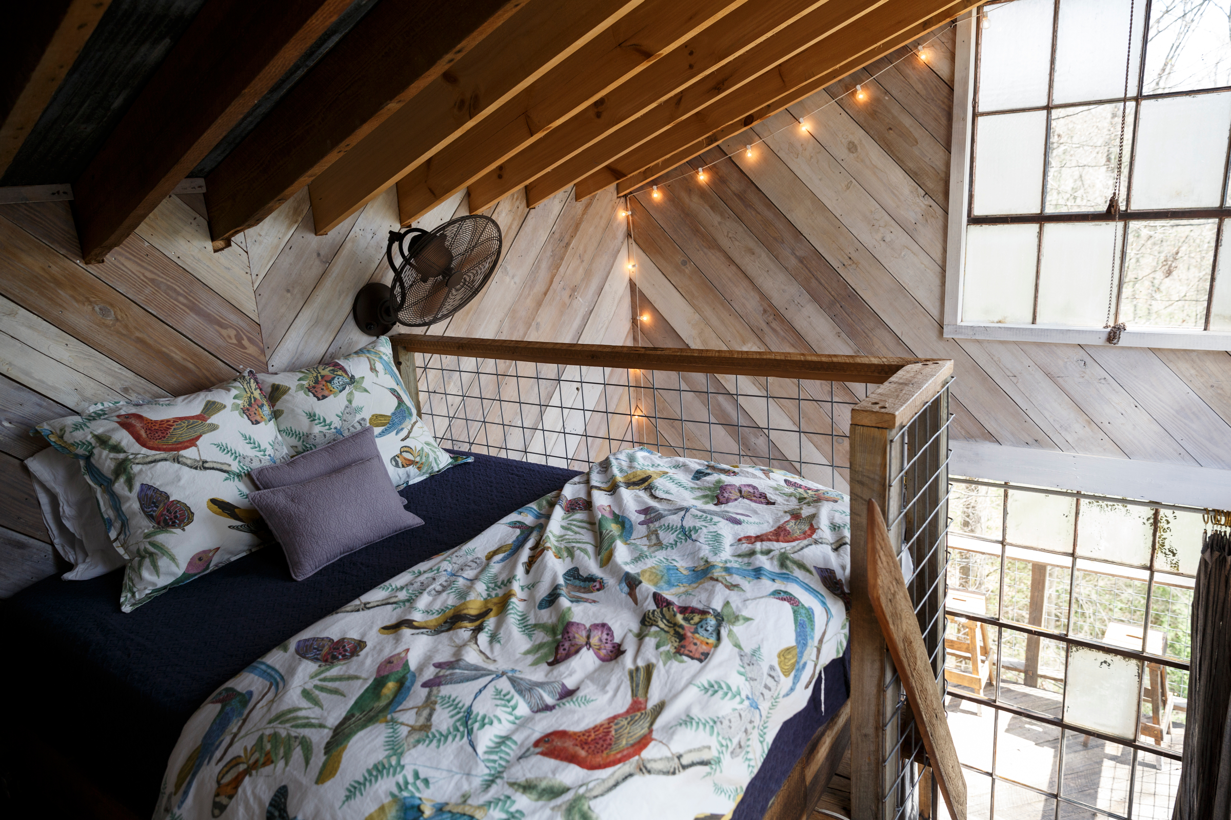 A loft bedroom in a treehouse vacation rental is seen on Saturday, March 31, 2018, in Flintstone, Ga.
