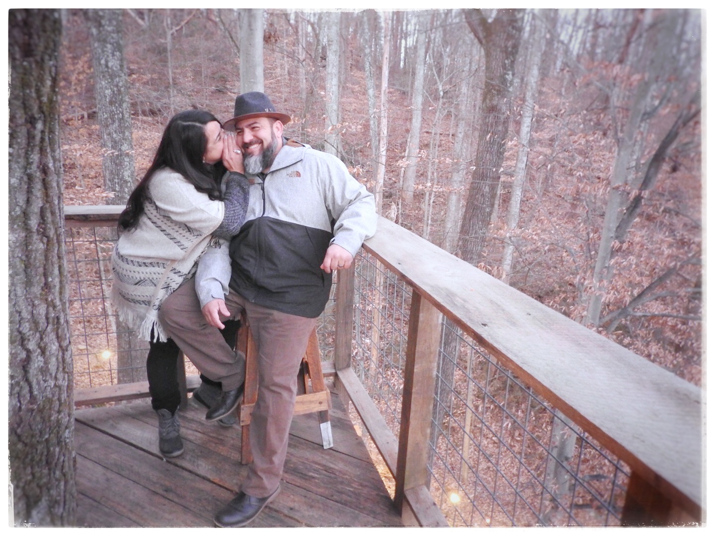 Marisol and Erney Bosque pose on the balcony of the Luna Loft treehouse in Flintstone, Ga. Marisol said staying in the treehouses created by Treetop Hideaways made her and her husband feel like kids again.