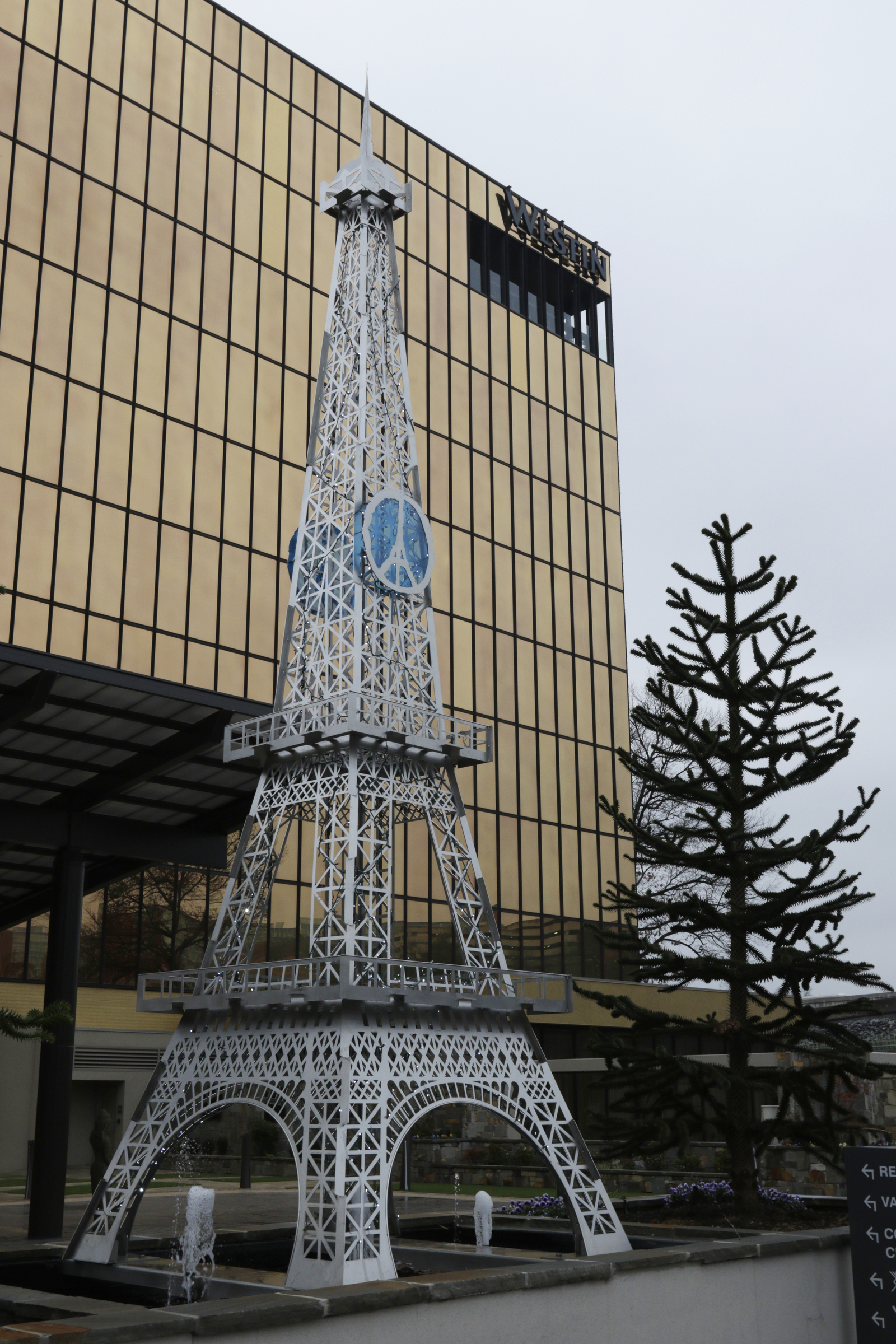 Staff photo by Doug Strickland / A model of the Eiffel Tower is seen outside the new downtown Westin hotel developed by brothers Byron and Ken DeFoor.