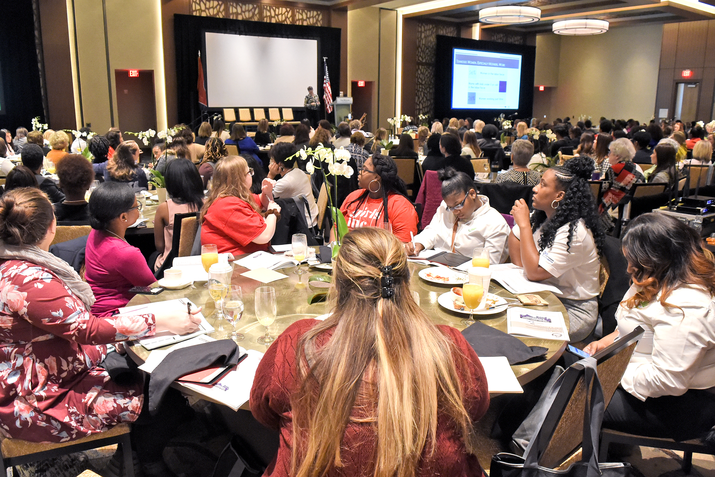 Staff Photo by Robin Rudd Women's Policy Conference attendees listen at a conference at the Westin hotel.