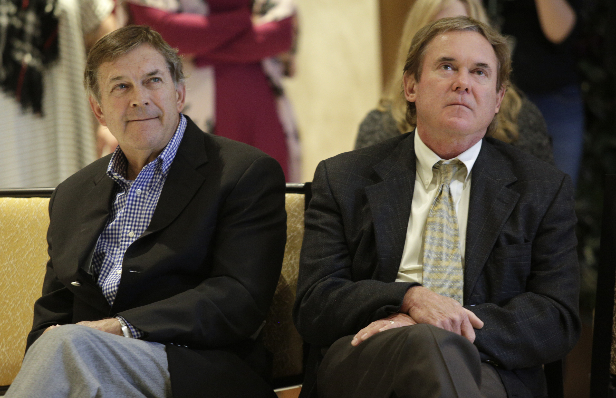 Staff photo by Doug Strickland / Developers Ken DeFoor, left, and Byron DeFoor listen to a speaker during the grand opening of the new downtown Westin hotel late last year.
