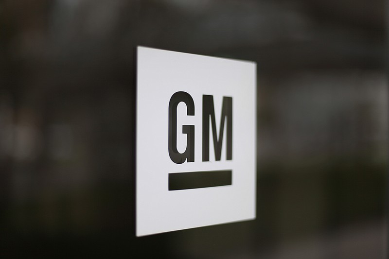 FILE - This Friday, May 16, 2014, file photo, shows the General Motors logo at the company's world headquarters in Detroit. General Motors Co. General Motors is adding a shift at a Tennessee factory that makes GMC and Cadillac SUVs, putting about 700 people to work. (AP Photo/Paul Sancya, File)