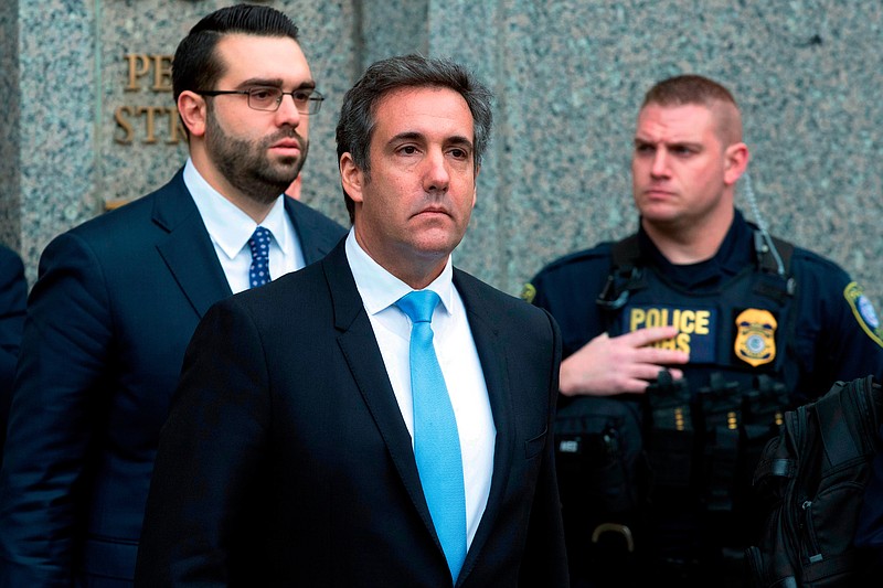 In a Monday, April 16, 2018, file photo, Michael Cohen, President Donald Trump's personal attorney, center, leaves federal court, in New York. Cohen filed papers in federal court in Los Angeles Wednesday, April 25, 2016, saying he will assert his Fifth Amendment rights, stating that he will exercise his constitutional right against self-incrimination in a lawsuit brought by porn actress Stormy Daniels, who said she had an affair with Trump. (AP Photo/Mary Altaffer, File)