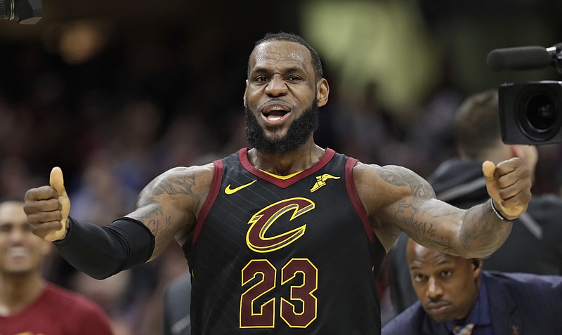 Cleveland Cavaliers' LeBron James celebrates after scoring the game-winning shot in the second half of Game 5 of an NBA basketball first-round playoff series against the Indiana Pacers, Wednesday, April 25, 2018, in Cleveland. The Cavaliers won 98-95. (AP Photo/Tony Dejak)