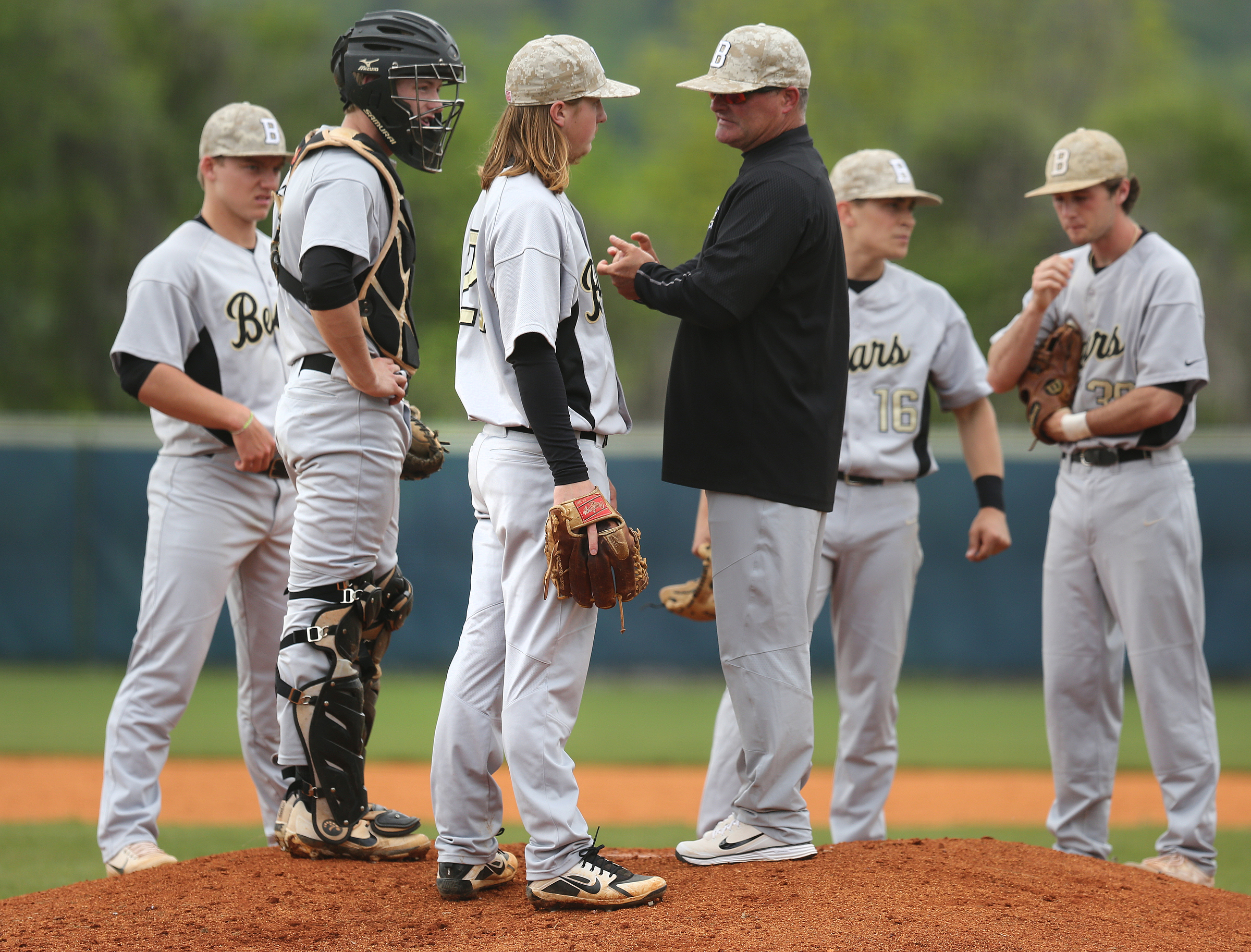 Bradley Central pitcher Blaze Benton (20) speaks with his coach Travis Adams as he is taken out of the game during the first Soddy-Daisy vs. Bradley Central baseball game at Soddy-Daisy High School Wednesday, April 25, 2018 in Soddy-Daisy, Tenn.