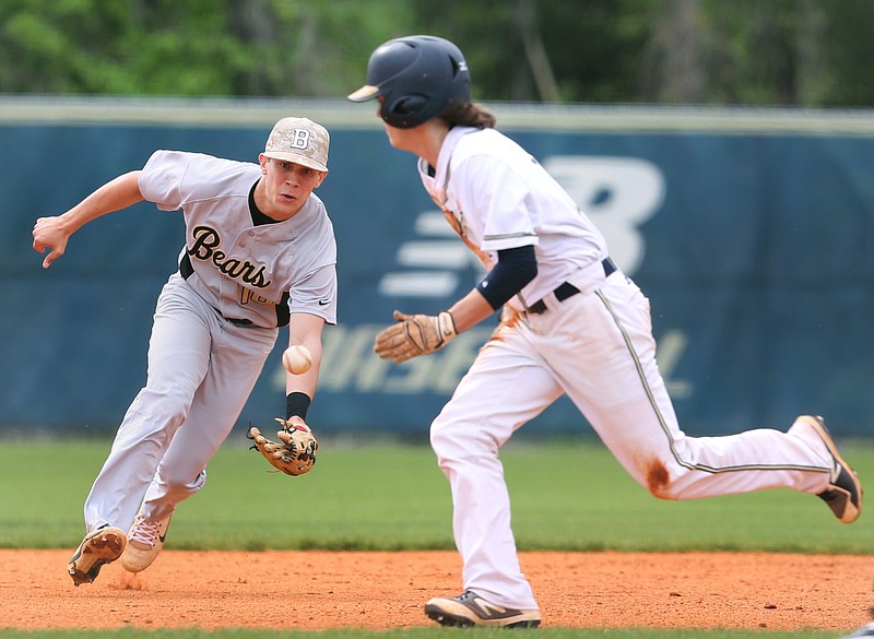 Bradley Central shortstop Pete Williams (16) goes after a ground ball as Soddy-Daisy's Jacob Jennings (19) runs in front of him during the first Soddy-Daisy vs. Bradley Central baseball game at Soddy-Daisy High School Wednesday, April 25, 2018 in Soddy-Daisy, Tenn. 