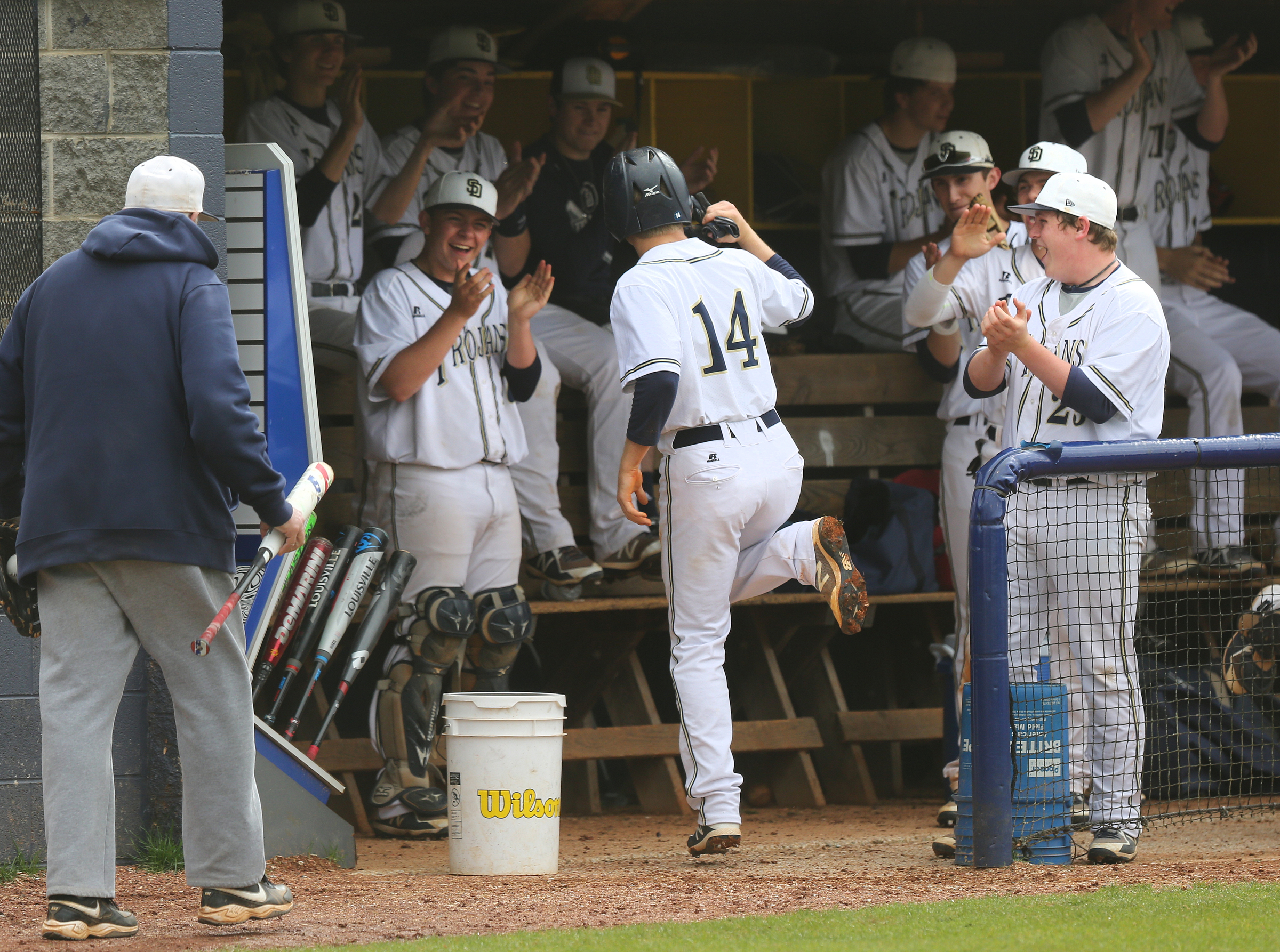Soddy-Daisy's Hayden Maynor (14) celebrates in the dugout after scoring during the first Soddy-Daisy vs. Bradley Central baseball game at Soddy-Daisy High School Wednesday, April 25, 2018 in Soddy-Daisy, Tenn.