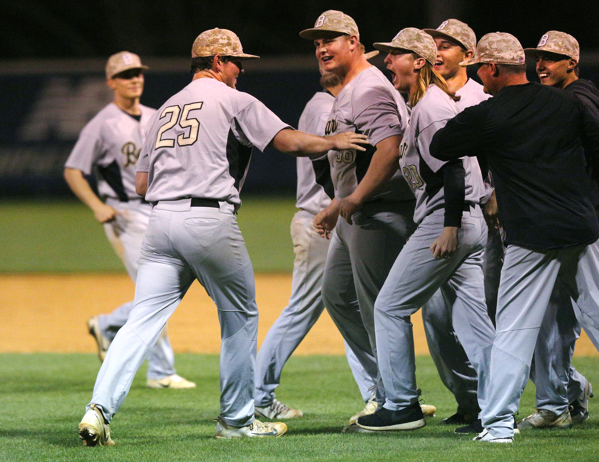Bradley Central pitcher Andy Bunch (25) is met by teammates celebrating Bradley Central's win over Soddy-Daisy in their second game of the night at Soddy-Daisy High School Wednesday, April 25, 2018 in Soddy-Daisy, Tenn.
