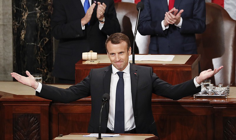 French President Emmanuel Macron gestures as he is introduced before speaking to a joint meeting of Congress on Capitol Hill in Washington, Wednesday, April 25, 2018.(AP Photo/Pablo Martinez Monsivais)