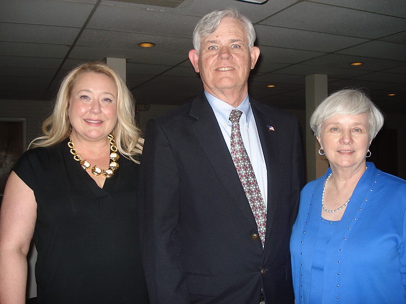 Ashley W. Evans, Volunteers in Medicine executive director, left, with Richard Franks and Nancy Franks, founding president of VIM. (Photo contributed by Volunteers in Medicine)