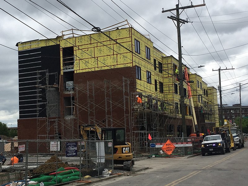 Construction crews work to build the $19 million Moxy hotel along King Street at Market Street in dowtown Chattanooga. The 108-room hotel is one of three new boutique hotels being added downtown this year in Chattanooga, helping to boost construction employmet in Chattanoga by 6 percent in the past 12 months.