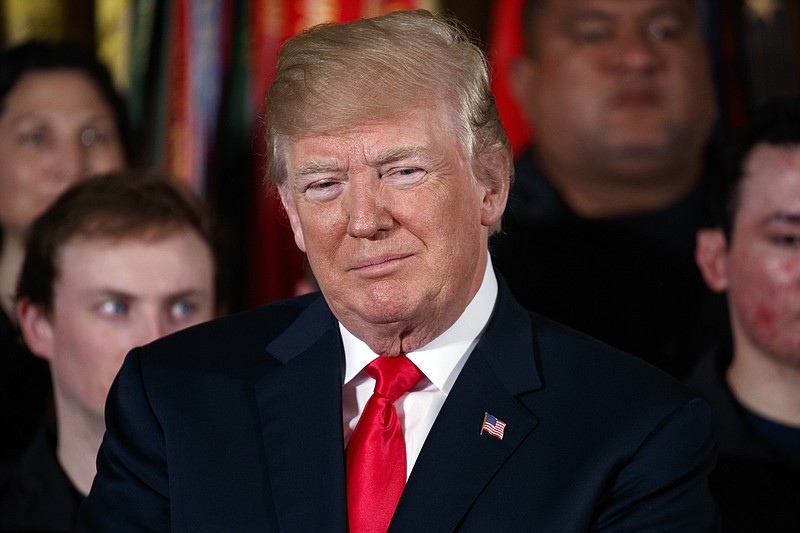 
              President Donald Trump listens during an event for the Wounded Warrior Project Soldier Ride in the East Room of the White House, Thursday, April 26, 2018, in Washington. (AP Photo/Evan Vucci)
            