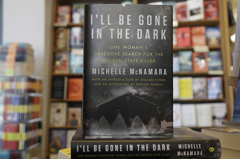 This Wednesday, April 25, 2018 photo shows copies of the books "I'll Be Gone in the Dark: One Woman's Obsessive Search for the Golden State Killer" by Michelle McNamara at a Books Inc. bookstore in San Francisco. California authorities say a man they suspect of being a serial killer tied to dozens of slayings and sexual assaults in the 1970s and '80s has been charged with murder. (AP Photo/Jeff Chiu)