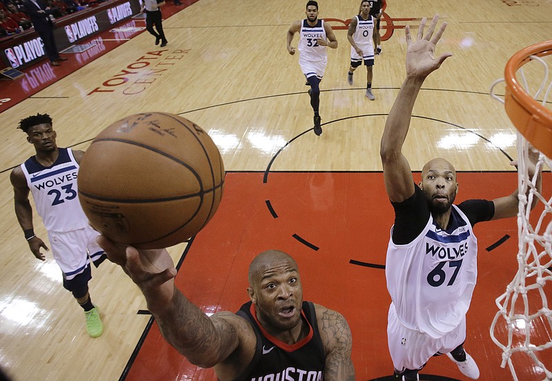 Houston Rockets forward PJ Tucker, left, drives to the basket as Minnesota Timberwolves forward Taj Gibson (67) defends during the first half in Game 5 of a first-round NBA basketball playoff series Wednesday, April 25, 2018, in Houston. (AP Photo/Eric Christian Smith)