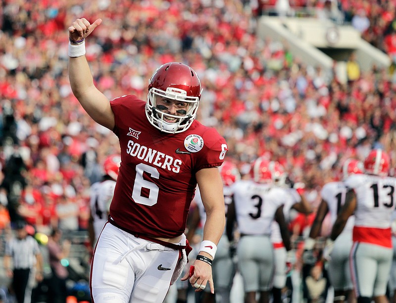 In this Jan. 1, 2018, file photo, Oklahoma quarterback Baker Mayfield celebrates after running back Rodney Anderson scored a touchdown against Georgia during the first half of the Rose Bowl NCAA college football game in Pasadena, Calif. Mayfield is expected to be a first round pick in the NFL Draft.(AP Photo/Jae C. Hong, File)