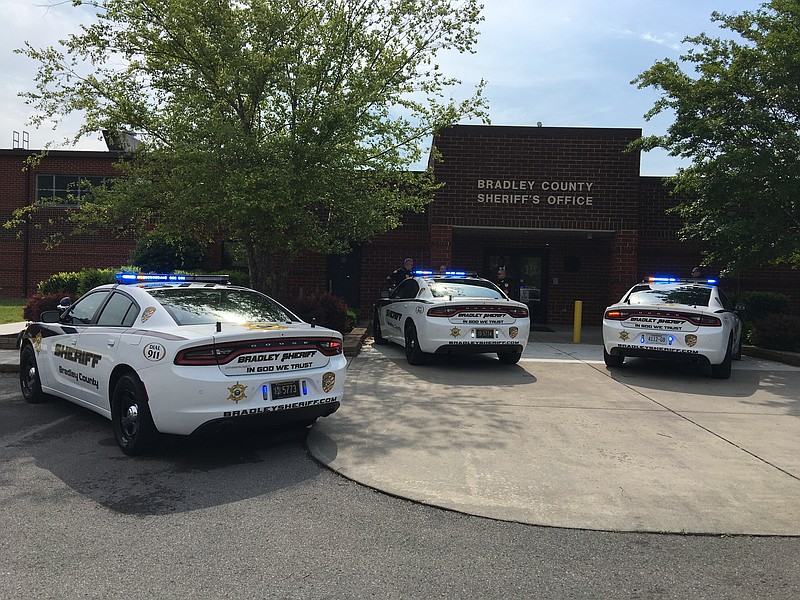 Patrol cars sit in front of the Bradley County Sheriff's Office. A local bail bonding agent claims the sheriff's office retaliated against her for blowing the whistle on insider knowledge held by the sheriff's wife, who is also a bonding agent.