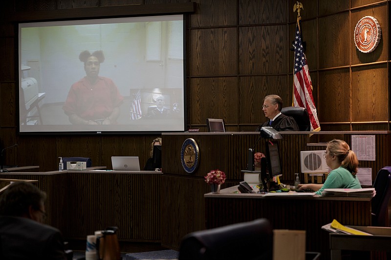 Courtney High is arraigned via remote video in Judge Tom Greenholtz's courtroom in the Chattanooga-Hamilton County Courts Building on Friday, April 27, 2018, in Chattanooga, Tenn. 45 of the alleged Athens Park Blood gang members indicted last month on RICO charges were arraigned Friday.