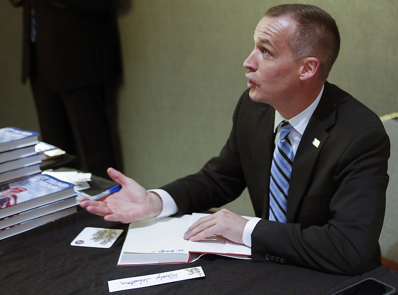 Corey Lewandoski chats while signing a copy of his book "Let Trump Be Trump," written with David Bossie, before speaking at the Hamilton County Republican Party's annual Lincoln Day Dinner at The Chattanoogan on Friday, April 27, 2018 in Chattanooga, Tenn.