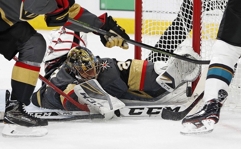 Vegas Golden Knights goaltender Marc-Andre Fleury makes a save against the San Jose Sharks during the first period of Game 1 of an NHL hockey second-round playoff series Thursday, April 26, 2018, in Las Vegas. (AP Photo/John Locher)