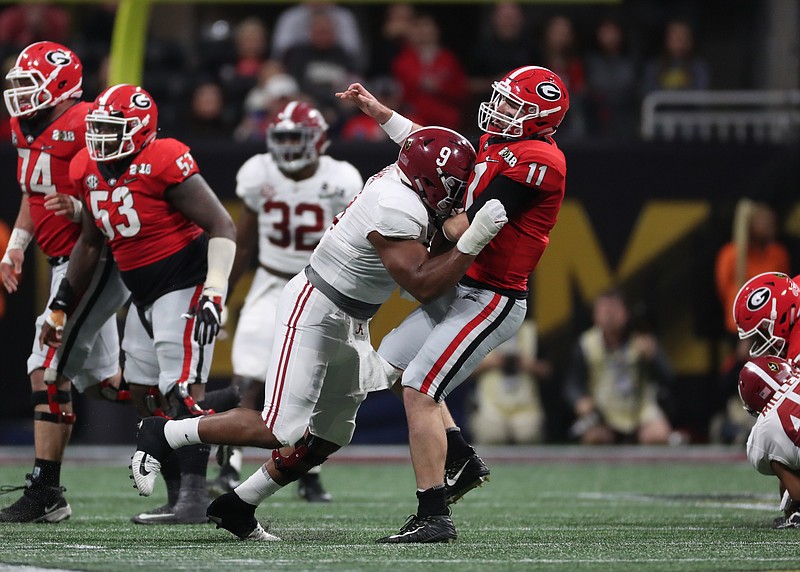 Defensive lineman Da'Shawn Hand (9) was among seven Alabama players selected Saturday and among the 12 Crimson Tide players taken throughout the 2018 NFL draft.