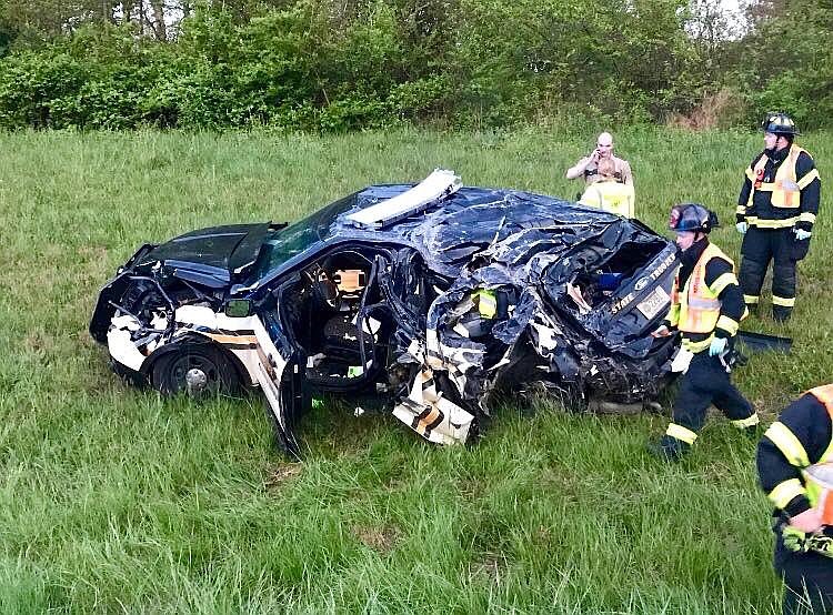 A semi truck crashed into this Tennessee Highway Patrol vehicle and a Coffee County deputy's car early Saturday morning on I-24 east near mile marker 112. They both were injured but have been released from the hospital. 

