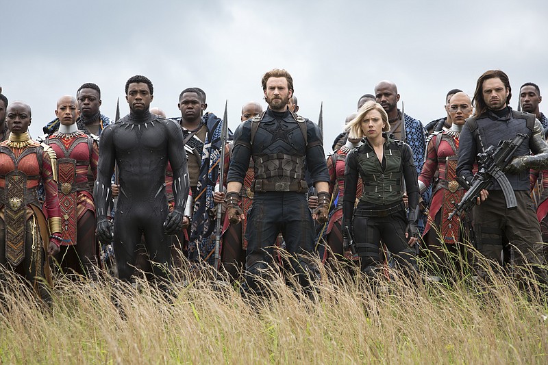 This image released by Marvel Studios shows, front row from left, Danai Gurira, Chadwick Boseman, Chris Evans, Scarlet Johansson and Sebastian Stan in a scene from "Avengers: Infinity War," premiering on April 27. (Chuck Zlotnick/Marvel Studios via AP)