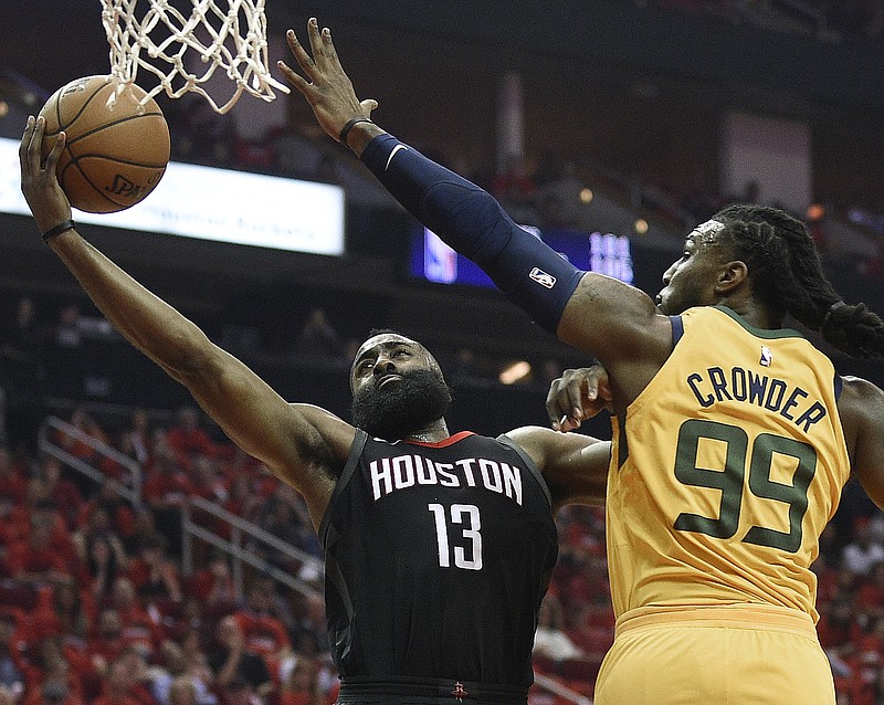 Houston Rockets guard James Harden (13) drives to the basket as Utah Jazz forward Jae Crowder defends during the first half in Game 1 of an NBA basketball second-round playoff series, Sunday, April 29, 2018, in Houston. (AP Photo/Eric Christian Smith)