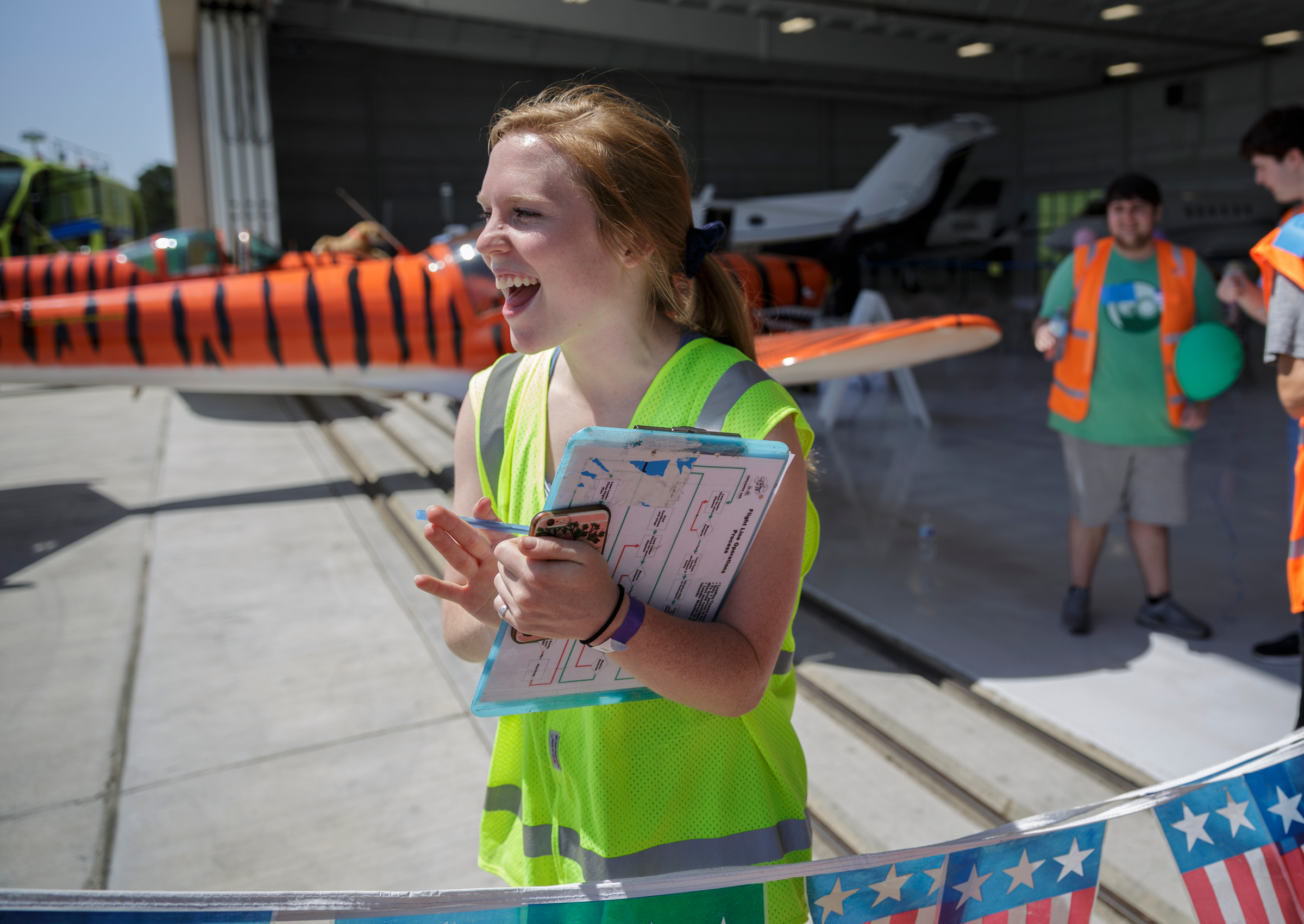 Grace Powell cheers as a participant returns from a flight during the Challenge Air Fly Day at the Chattanooga Airport's Wilson Air Center on Saturday, April 28, 2018, in Chattanooga, Tenn. Fly Day offers youth ages 7 to 21 with intellectual or physical disabilities and their families the chance to experience a 30-minute small-aircraft flight and to learn about aviation.