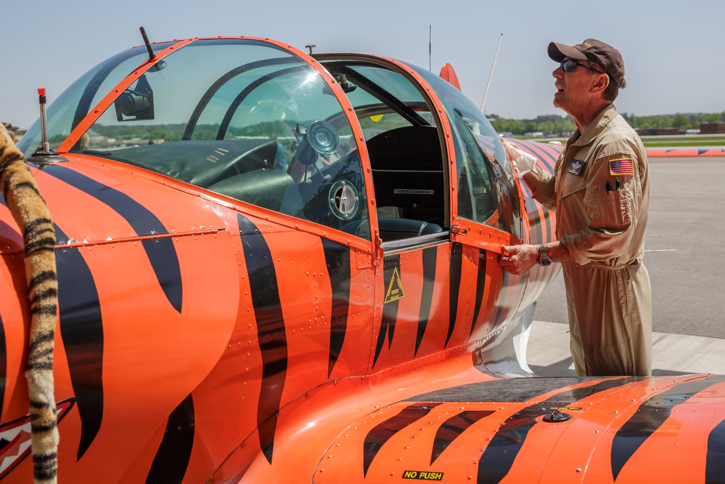 Phil Cataldo with the Tiger Flight formation flight team checks his aircraft during the Challenge Air Fly Day at the Chattanooga Airport's Wilson Air Center on Saturday, April 28, 2018, in Chattanooga, Tenn. Fly Day offers youth ages 7 to 21 with intellectual or physical disabilities and their families the chance to experience a 30-minute small-aircraft flight and to learn about aviation.