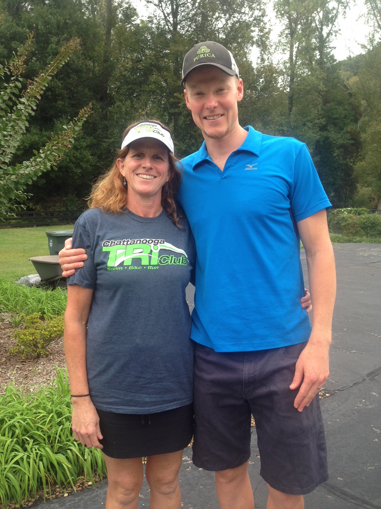 Katie Schumacher poses with professional triathlete Adam O'Meara, whom Schumacher hosted in 2015.