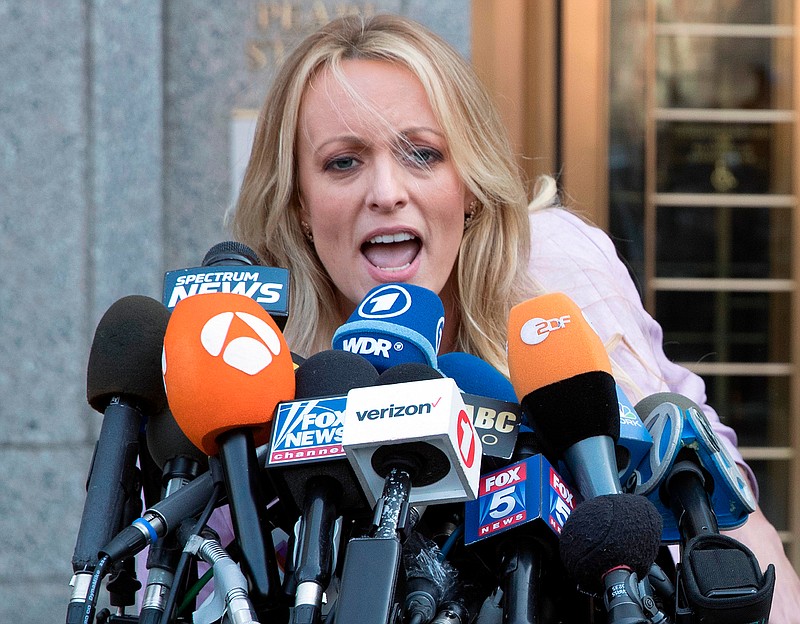 In this April 16, 2018, photo, adult film actress Stormy Daniels outside federal court in New York. Stormy Daniels filed a defamation complaint in federal court in New York on Monday. At issue is a tweet Trump made in which he dismissed a composite sketch that Daniels says depicts a man who threatened her in 2011 to stay quiet about her alleged sexual encounter with Trump. (AP Photo/Mary Altaffer)