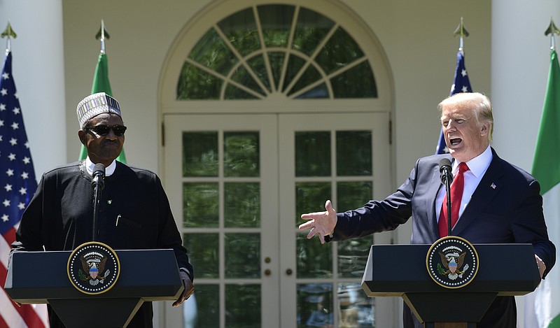President Donald Trump, right, speaks during a news conference with Nigerian President Muhammadu Buhari, left, in the Rose Garden of the White House in Washington, Monday, April 30, 2018. (AP Photo/Susan Walsh)