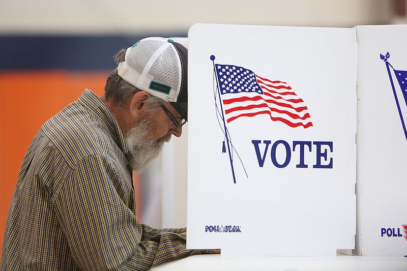 Billy "Ironman" Collier fills out his ballot Tuesday, May 1, 2018 during primary elections in the gym at East Ridge City Hall in East Ridge, Tenn. Voter traffic was light, but fairly steady throughout the evening hours.