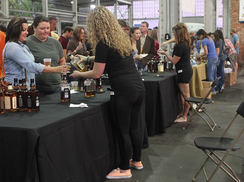 Distilleries served samples of their wares at the Tennessee Whiskey Festival at the First Tennessee Pavilion on Saturday in Chattanooga, Tenn. 