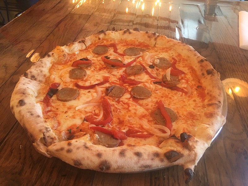 The Sausage and Peppers pizza at Pizzeria Cortile includes red sauce, cheese blend, roasted bell peppers, onions and Italian sausage.