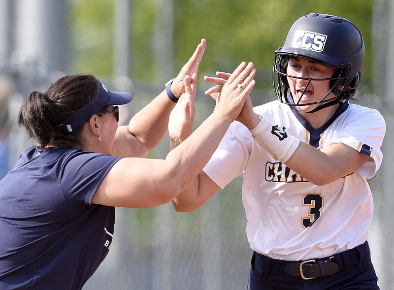 Christian's Mary Vandergriff (3), celebrates with head coach Lisa Gray, after hitting a lead-off home run.  The Silverdale Seahawks visited the Chattanooga Christian Chargers in TSSAA Division II-A girl's softball tournament
action on May 1, 2018.  