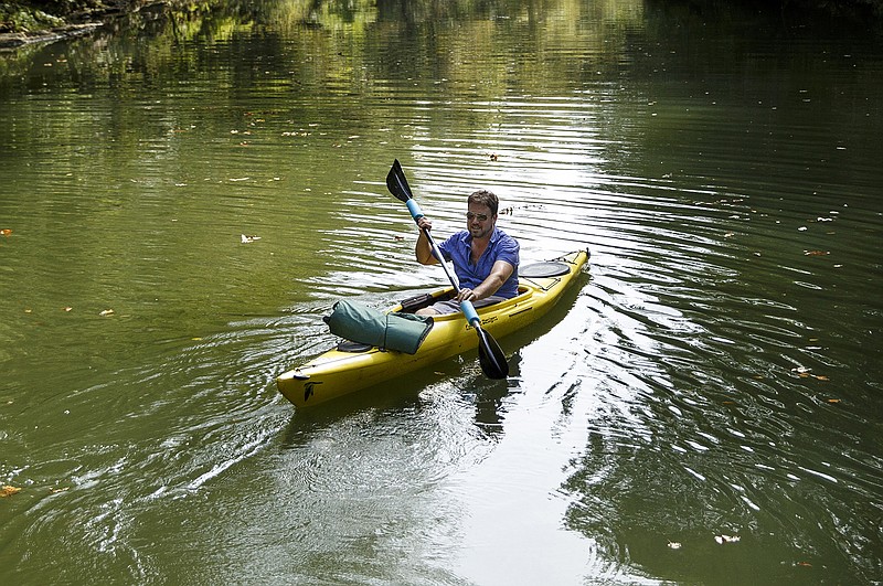Daniel Randolph paddles on Chickamauga Creek after putting in at Hixson's GreenwayFarms.