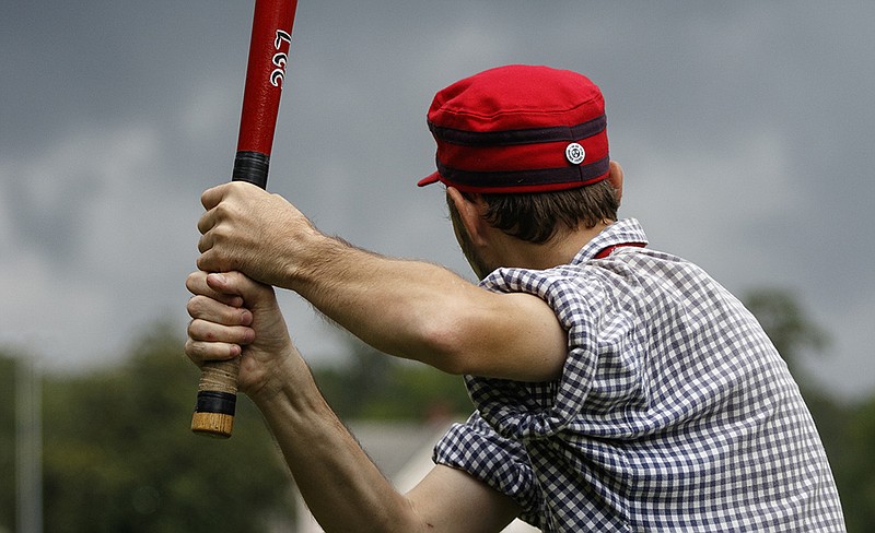 Lightfoot player John "Sole Man" Neal bats during the 6th Cavalry Cup Championship vintage baseball game at the Barnhardt Circle polo field.
