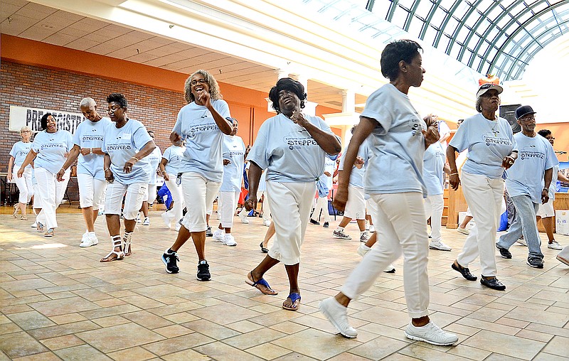 Staff Photo by Robin Rudd The Eastgate Senior Activity Center Steppers perform at the health fair. The 15th annual Hamilton County Minority Health Fair was held at the Eastgate Town Center on August 19, 2017.