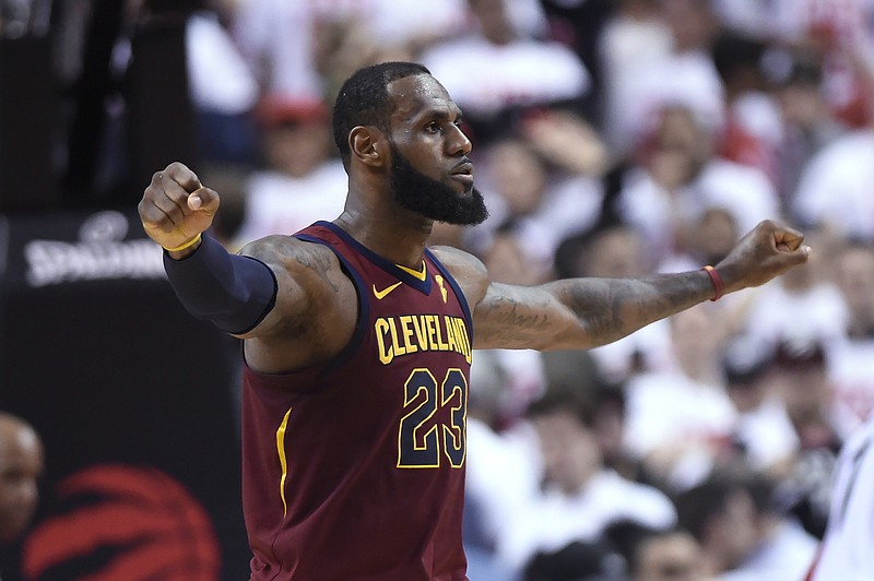 Cleveland Cavaliers forward LeBron James celebrates after the Cavaliers defeated the Toronto Raptors in Game 1 of an NBA basketball playoffs Eastern Conference semifinal, Tuesday, May 1, 2018, in Toronto. (Nathan Denette/The Canadian Press via AP)