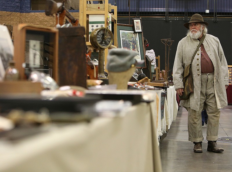 Johnny Sparks of Ringgold, Ga., looks at Civil War relics as he walks down rows of tables during the Chickamauga Civil War Show Sunday, Feb. 4, 2018 at the Dalton Convention Center in Dalton, Ga. Sparks, who is a member of the Sons of the American Veterans, said he has visited the event for about 18 years and is alway amazed at the vast array of items people have collected.