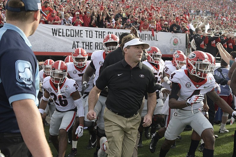 Georgia football coach Kirby Smart, shown leading the Bulldogs onto the field in the Rose Bowl against Oklahoma on New Year's Day, received a seven-year, $49 million contract Thursday afternoon.