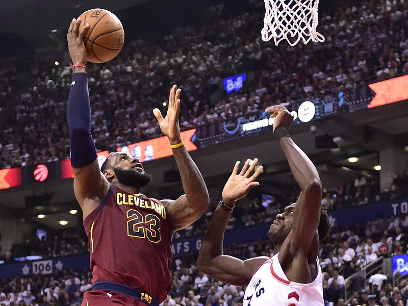 Cleveland Cavaliers forward LeBron James (23) shoots over Toronto Raptors forward Pascal Siakam during the second half of Game 2 of an NBA basketball playoffs second-round series Thursday, May 3, 2018, in Toronto. (Frank Gunn/The Canadian Press via AP)