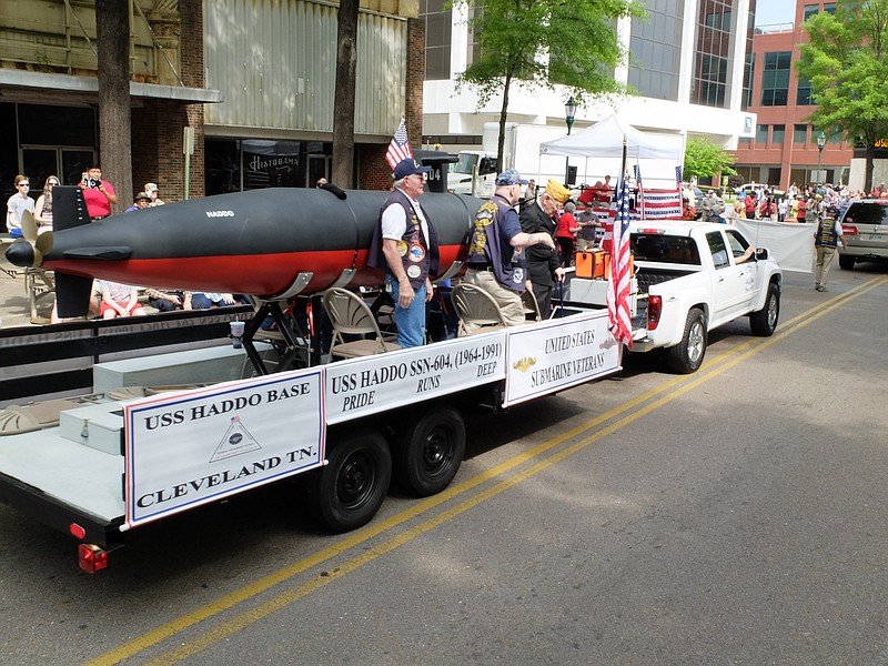 United States Submarine Veterans from Cleveland, Tenn., ride a trailer with a replica of the USS Haddo, SSN-604 Friday during the annual Armed Forces Day Parade on Market Street.