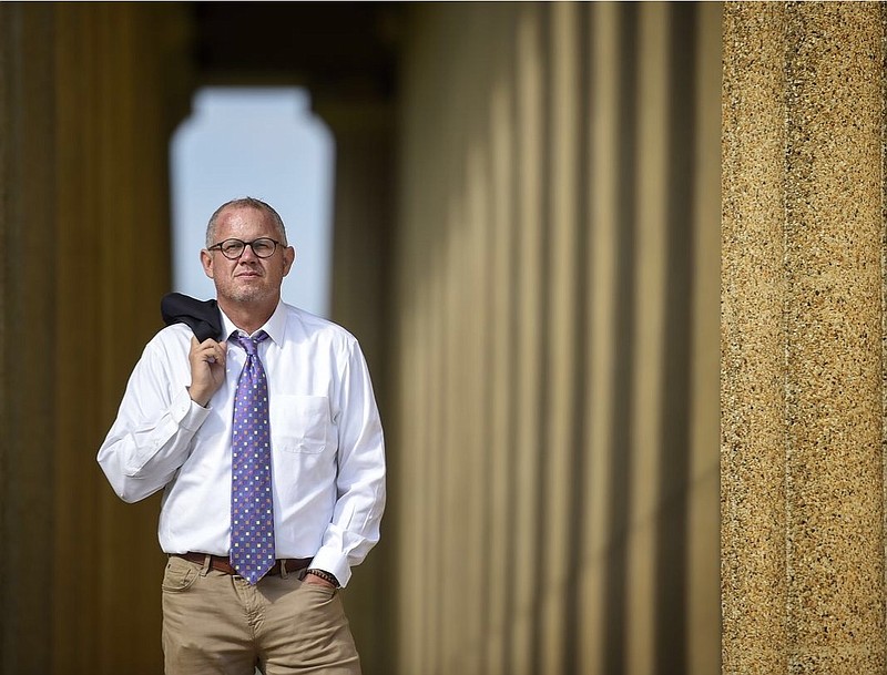 Dr. Stephen Loyd, then assistant commissioner for Tennessee Substance Abuse Services division, poses for a portrait at the Parthenon in Centennial Park in Nashville on Aug. 30, 2017. 