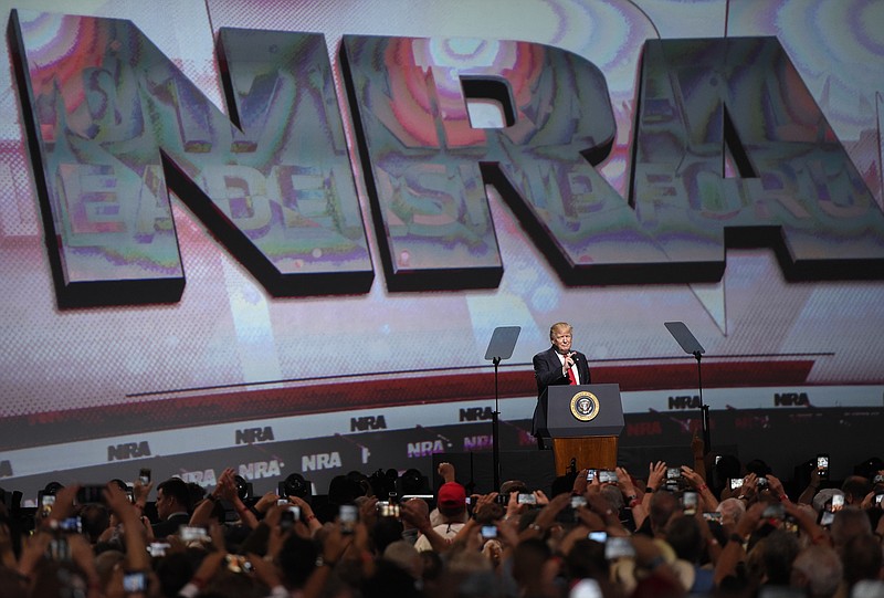 In this April 28, 2017 file photo, President Donald Trump speaks during the National Rifle Association-ILA Leadership Forum, in Atlanta. As NRA prepares to gather for its 147th annual meeting in Dallas, the political landscape has changed considerably in the past year. Even with a GOP-led Congress and a gun-friendly president in the White House, its agenda has stalled. And a new generation seems to have the upper hand in pushing for gun-control after several deadly mass shootings. (AP Photo/Mike Stewart File)