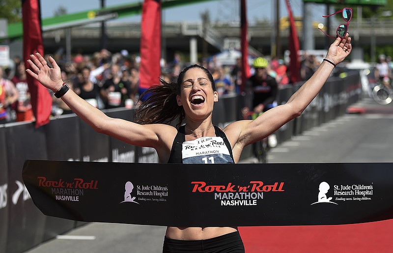 
              In this April 28, 2018, photo, Stella Christoforou competes inthe Rock n' Roll Marathon in Nashville, Tenn. Christoforou is the first woman to cross finish line for the Rock n' Roll Marathon with a time of 02:53:46, 14 minutes ahead of second-place finisher Heather Crowe of Palatine, Ill. (George Walker IV/The Tennessean via AP)
            