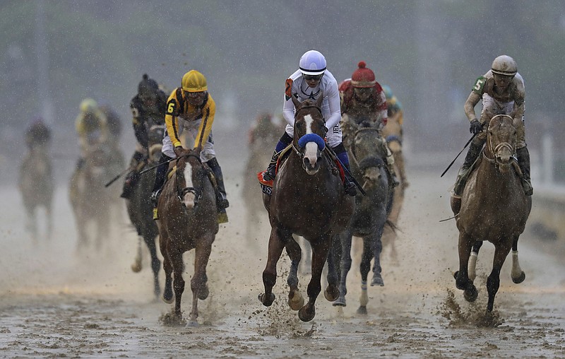 Mike Smith rides Justify to victory during the 144th running of the Kentucky Derby horse race at Churchill Downs Saturday, May 5, 2018, in Louisville, Ky. (AP Photo/Darron Cummings)

