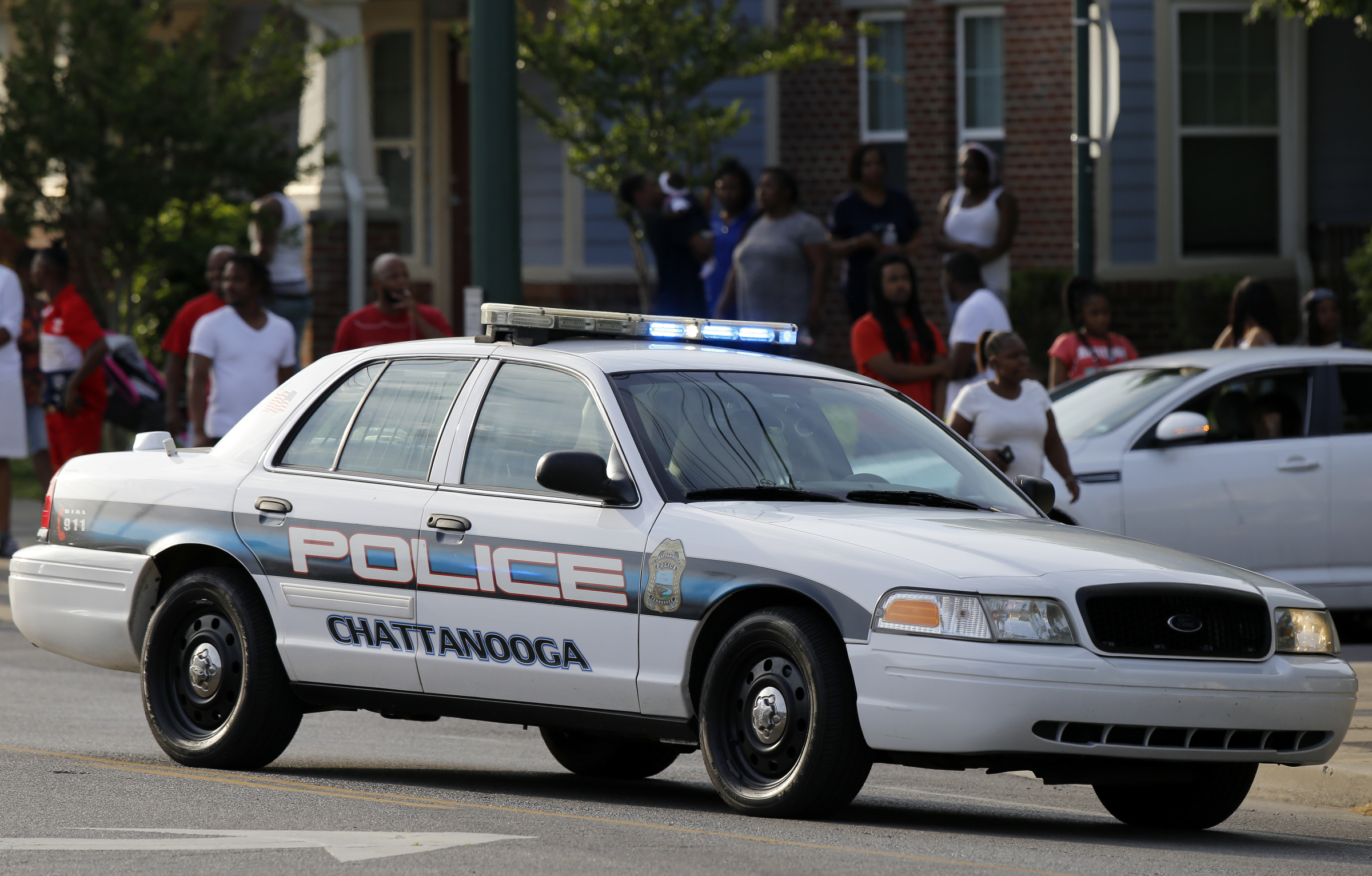 A police car is sits near the intersection of Central Avenue and West 38th Street as officers investigate a fatal shooting on Sunday, May 6, 2018 in Chattanooga, Tenn.