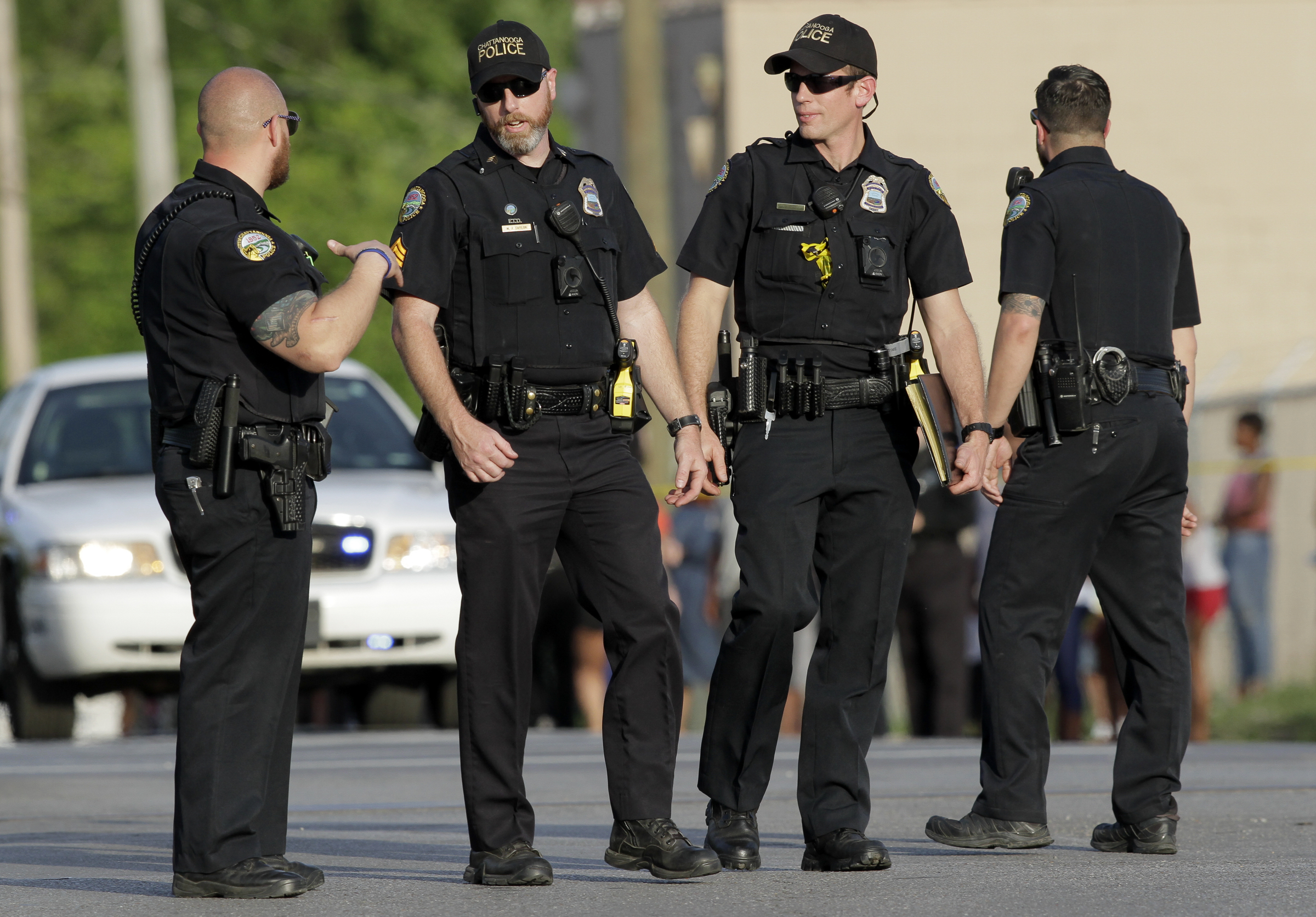 Police officers work the scene of a fatal shooting at the intersection of Central Avenue and West 38th Street on Sunday, May 6, 2018 in Chattanooga, Tenn.